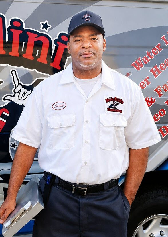 James, owner and master plumber at Houdini's Plumbing, in front of the service truck James, owner and master plumber at Houdini's Plumbing, in front of the service truck